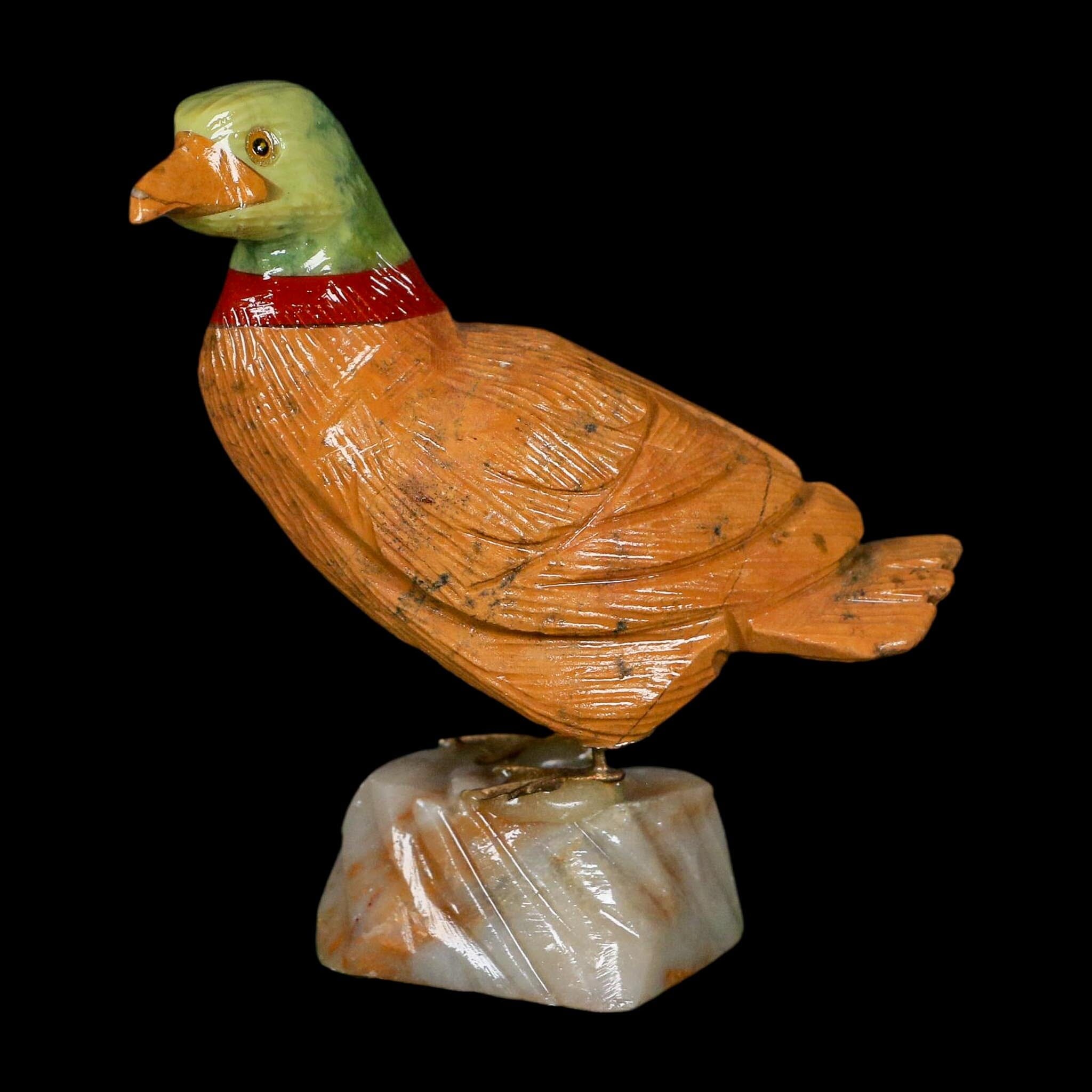 3.3" Hand Carved Duck Perched on Brown Calcite, Red Calcite, And Serpentine Peru - Fossil Age Minerals