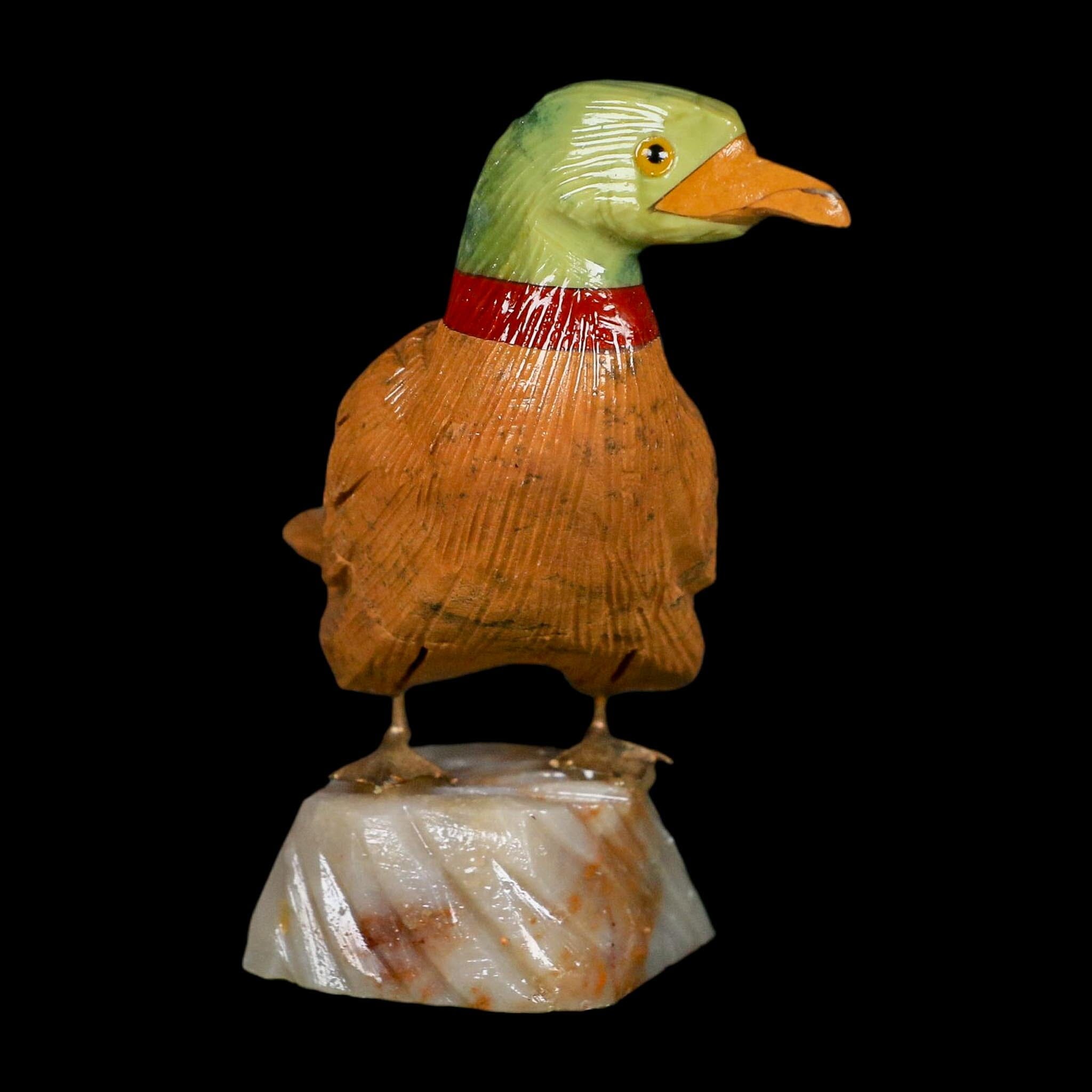 3.3" Hand Carved Duck Perched on Brown Calcite, Red Calcite, And Serpentine Peru - Fossil Age Minerals